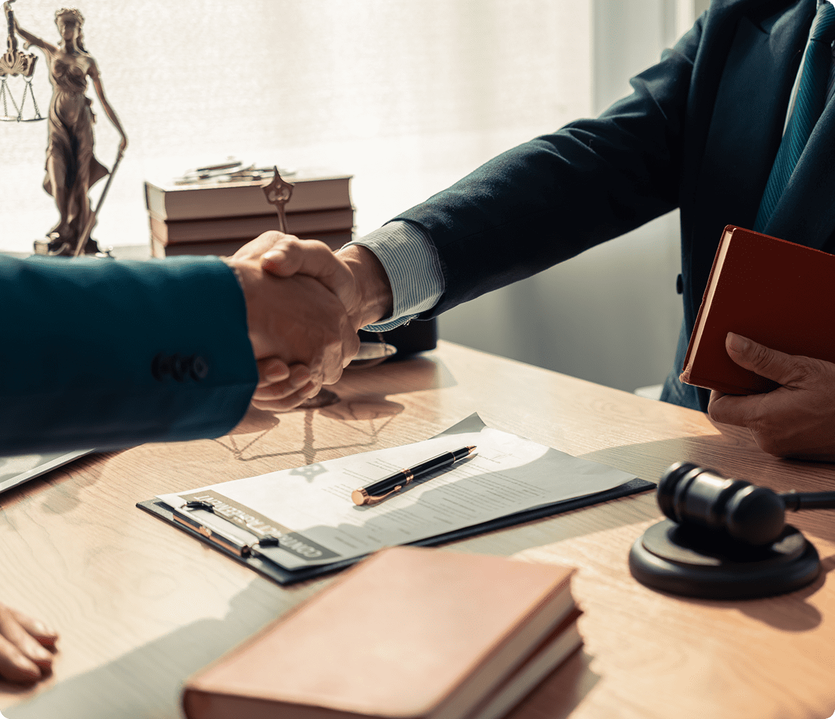 Businessmen shaking hands in office setting