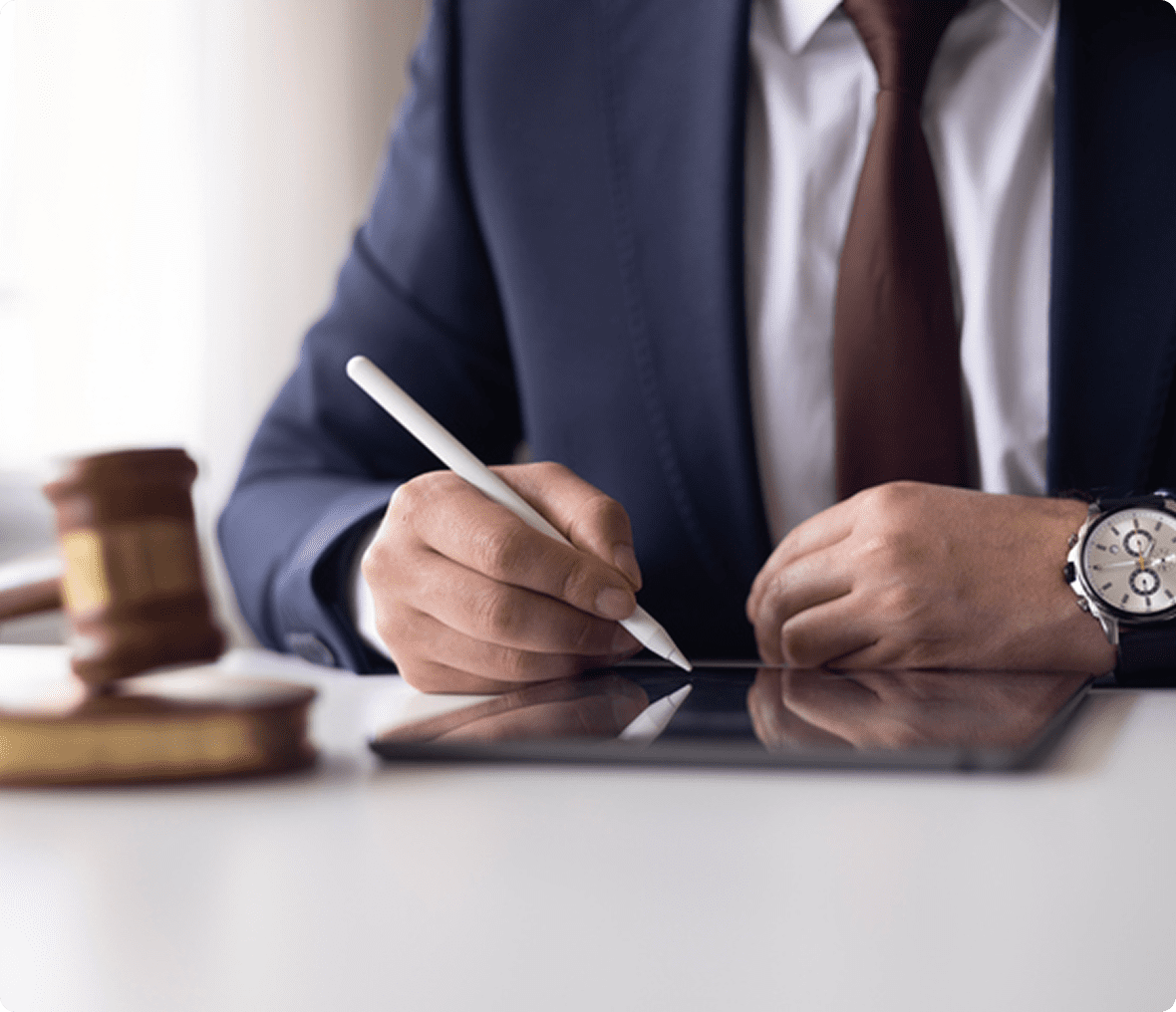 Man in suit using digital tablet