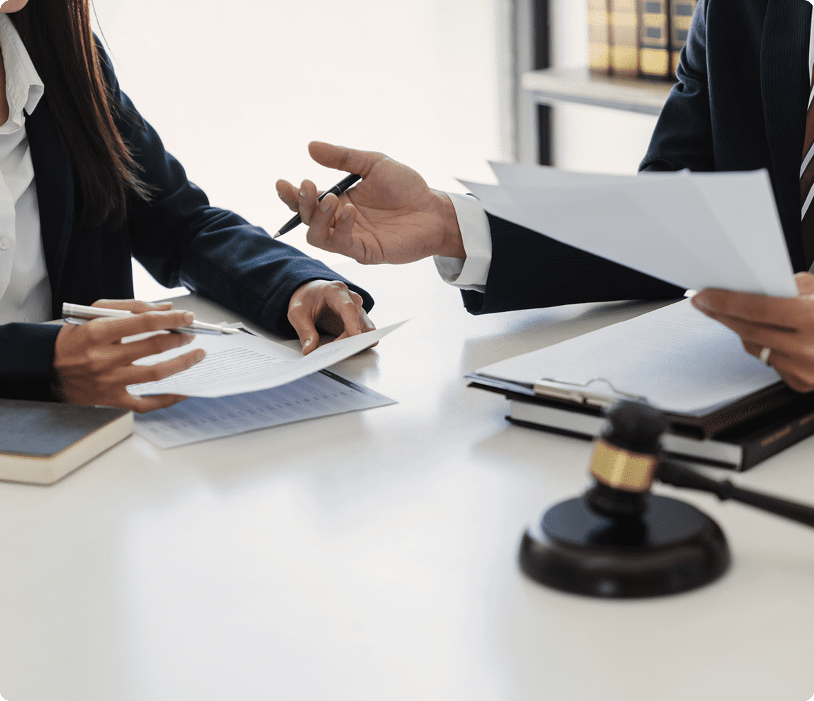 Attorneys in a meeting with documents